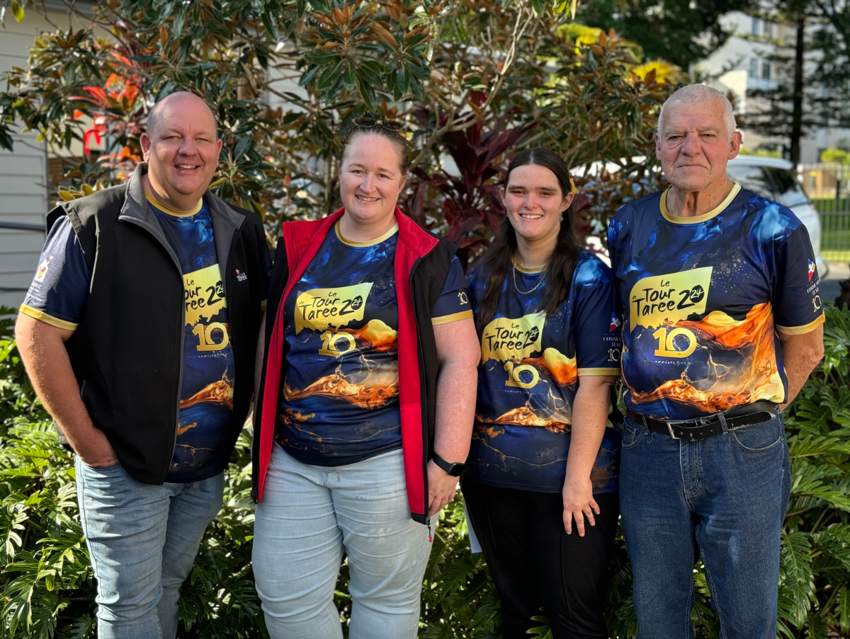 Four members from the Club Taree Community team pose for a photo in front of shrubbery at the Ronald McDonald Family Retreat